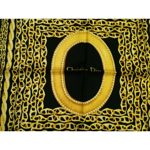 Foulard Dior en soie noir et or.
