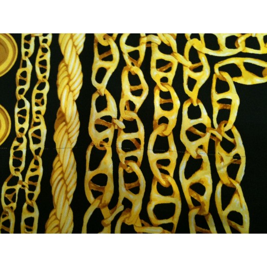 Foulard Dior en soie noir et or.