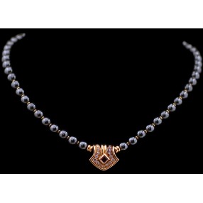 Collier Boucheron en or, rubis, diamants et hématite