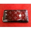 Compagnon Louis Vuitton Zippy Amarante en cuir monogram vernis