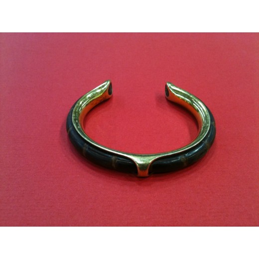 Bracelet Hermès demi jonc en cuir et métal doré
