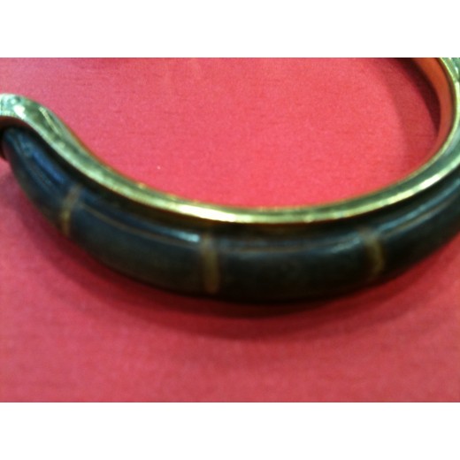 Bracelet Hermès demi jonc en cuir et métal doré