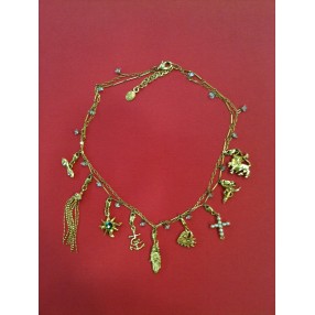 Collier Christian Lacroix en métal doré avec breloques