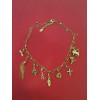Collier Christian Lacroix en métal doré avec breloques