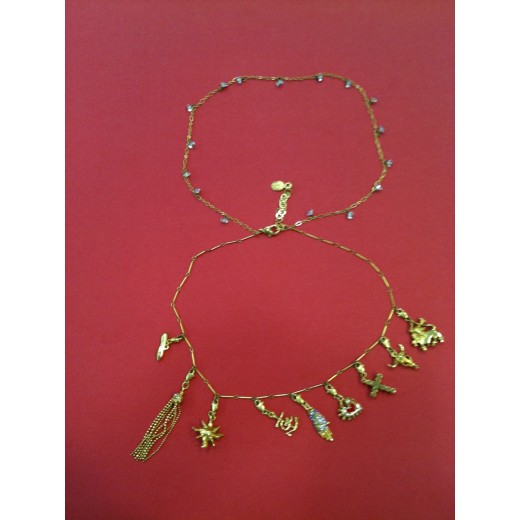 Collier Christian Lacroix en métal doré avec breloques