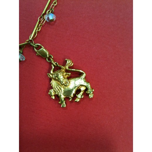 Collier Christian Lacroix en métal doré avec breloques