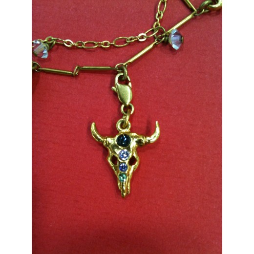 Collier Christian Lacroix en métal doré avec breloques