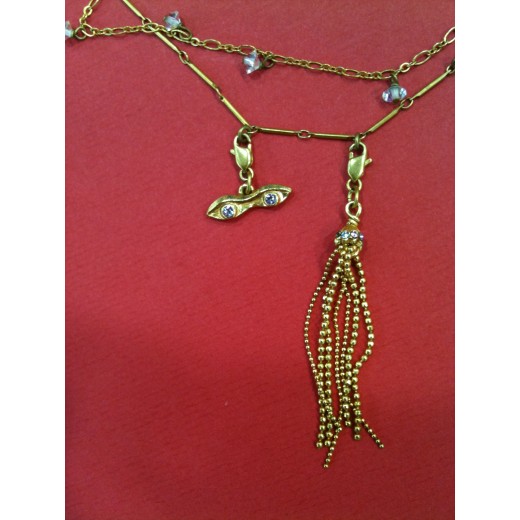 Collier Christian Lacroix en métal doré avec breloques