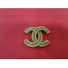 Broche Chanel en métal doré