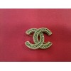 Broche Chanel en métal doré