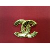 Broche Chanel en métal doré