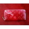 Portefeuille Louis Vuitton Zippy en cuir monogram vernis