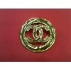 Broche Chanel en métal doré