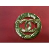 Broche Chanel en métal doré