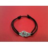 Bracelet Dinh Van Menottes R12 sur cordon noir