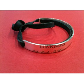 Bracelet Hermès Cartouche en cuir noir et argent