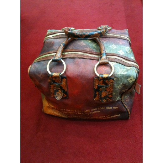 Sac Louis Vuitton Mancrazy en toile, cuir et Karung