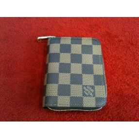 Porte-monnaie Louis Vuitton Zippy en toile damier ébène