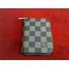 Porte-monnaie Louis Vuitton Zippy en toile damier ébène