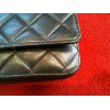 Pochette Chanel avec chaîne en agneau matelassé noir