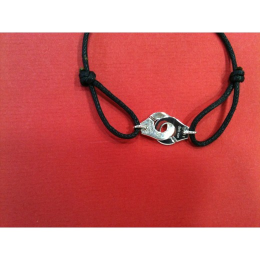 Bracelet Dinh Van Menottes R12 en argent sur cordon noir