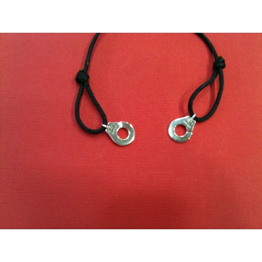 Bracelet Dinh Van Menottes R12 en argent sur cordon noir