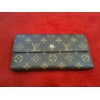 Portefeuille Louis Vuitton Trésor en toile monogram 