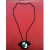 Pendentif Bernardaud en porcelaine et résine sur cordon noir