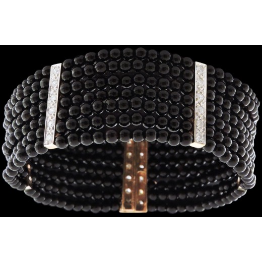 Bracelet manchette deux ors onyx et diamants