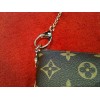 Pochette Louis Vuitton Milla MM en toile monogram