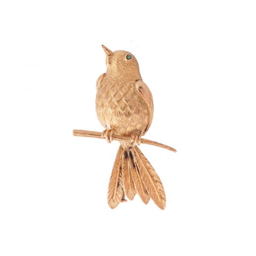 Broche oiseau e nor et yeux émeraude