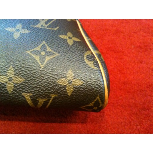 Pochette Louis Vuitton Eva en toile monogram