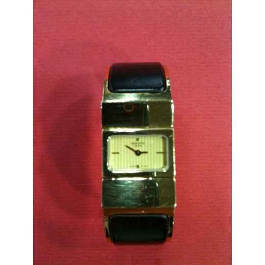 Montre Hermès Clic-Clac en bois et plaqué or