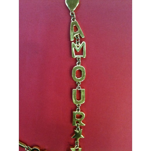 Collier Yves Saint Laurent en métal doré