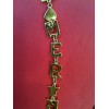Collier Yves Saint Laurent en métal doré
