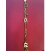 Collier Yves Saint Laurent en métal doré