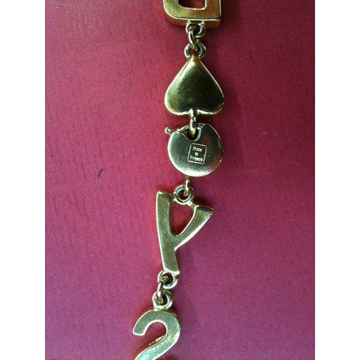Collier Yves Saint Laurent en métal doré
