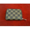 Porte-monnaie Louis Vuitton Zippy en toile damier ébène