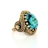 Bague en or jaune 18 k et pierre bleue