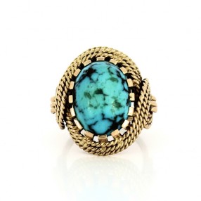 Bague en or jaune 18 k et pierre bleue