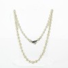 Collier perles de culture en choker et fermoir noeud en diamants