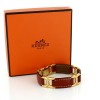 Bracelet Hermès en cuir et plaqué or