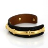 Bracelet Hermès en cuir de lézard et plaqué or
