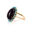 Bague en or jaune avec cabochon grenat et turquoises