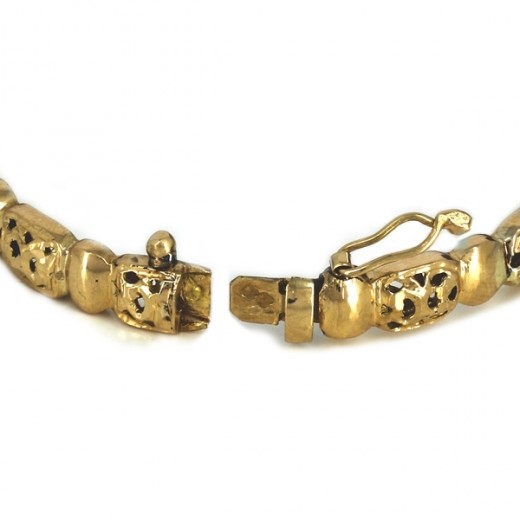 Bracelet articulé ajouré en or jaune 18k