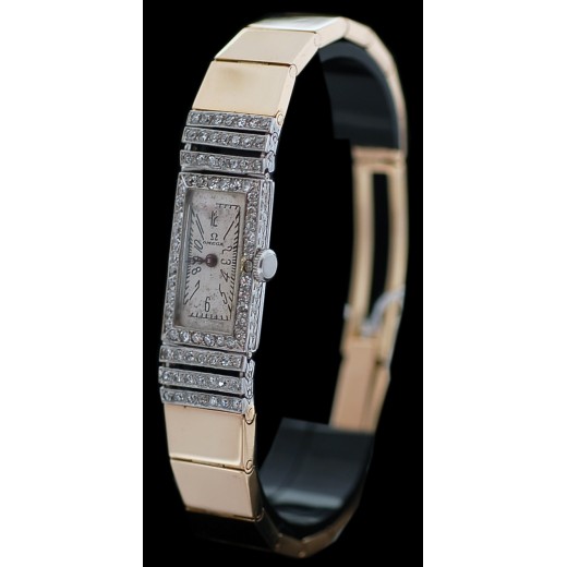 Montre OMEGA en or et diamants