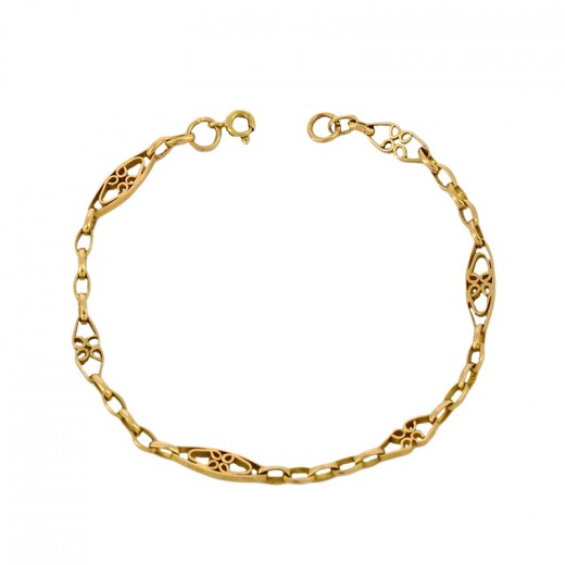 Bracelet doré serti de pierres rouges