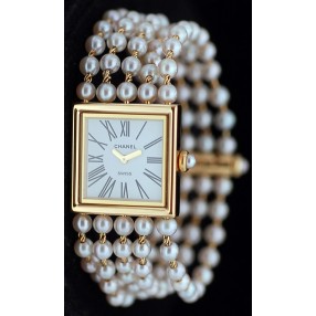 Montre Chanel " Mademoiselle " Or et perles