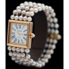 Montre Chanel " Mademoiselle " Or et perles